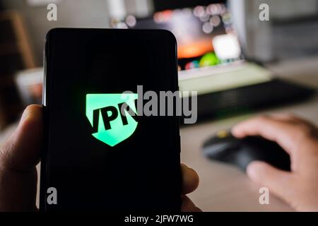 uses VPN application on smartphone. Virtual private network, anonymous, safe and secure internet access on mobile phone. Desktop banner, technology ba Stock Photo