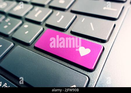 the heart is a symbol of love or like on the button on the keyboard. Expression of respect for the content on the web site. Stock Photo