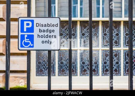 Traffic sign displaying the message “disabled badge holders only”. Liverpool, Merseyside, Lancashire, England, United Kingdom Stock Photo