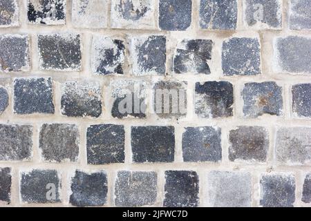 A wall of made of grey bricks Stock Photo