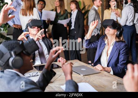 managers of a company using virtual reality to improve performance Stock Photo