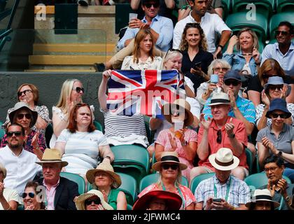5th July 2022,  All England Lawn Tennis and Croquet Club, London, England;  Wimbledon Tennis tournament; Spectator inside Court Number One waving the United Kingdom flag in support of Cameron Norrie (GBR) Credit: Action Plus Sports Images/Alamy Live News Stock Photo