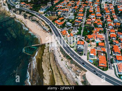 Aerial drone view of Marginal Avenue and coastline with Parade district in Greater Lisbon, Portugal Stock Photo