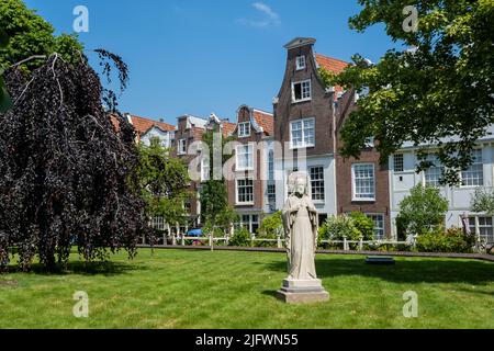 Amsterdam, The Netherlands - 23 June 2022: The Begijnhof is one of the oldest hofjes (courtyard) in Amsterdam Stock Photo