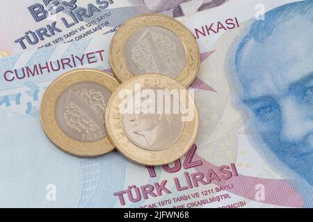 close up of Turkish lira coins lying on Turkish lira banknotes Stock Photo