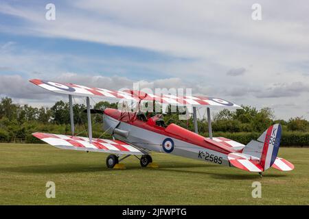 1931 DH82a Tiger Moth “K2585”  on static display at the Fly Navy Airshow held at Shuttleworth, Old Warden on the 3rd July 2022 Stock Photo