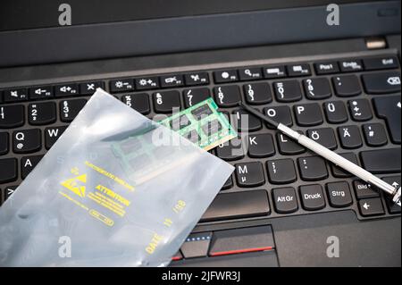 RAM is upgraded and placed in ESD packaging on a PC keyboard - The ...