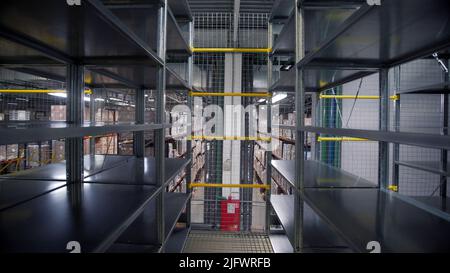 Storage.Creative.A man who arranges boxes and uses special vehicles for delivery. High quality 4k footage Stock Photo