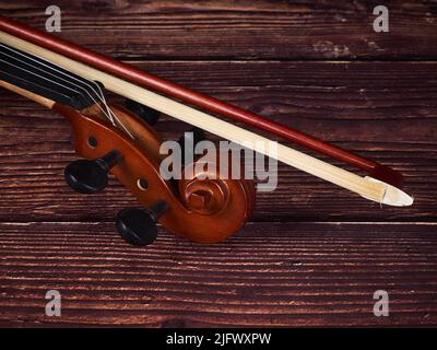 High angle view of a violin on a wood table Stock Photo