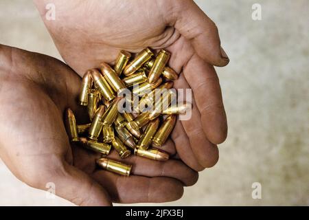 Bullets in Hand Stock Photo