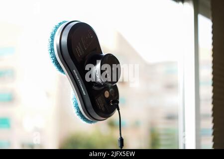 Granada, Andalusia, Spain. July , 5th 2022 Robot window cleaner Windroid 870 Connected, Conga working on dirty window. Stock Photo