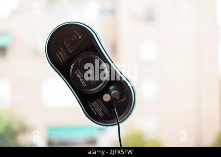 Granada, Andalusia, Spain. July , 5th 2022 Robot window cleaner Windroid 870 Connected, Conga working on dirty window. Stock Photo