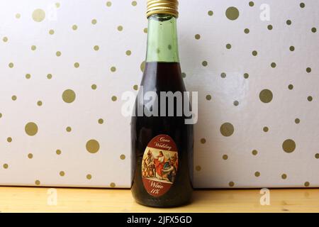 The bottle of wine from the "Wedding Mug" collection on a background with polka dots Stock Photo