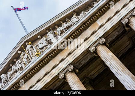 Neoclassical pediment. Main entrance. The British Museum is a public museum dedicated to human history, art and culture located in the Bloomsbury area Stock Photo