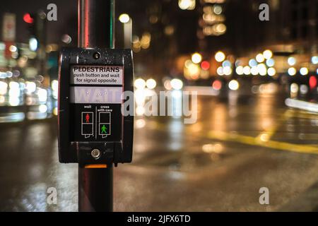 Pedestrian crossing signal at night Stock Photo