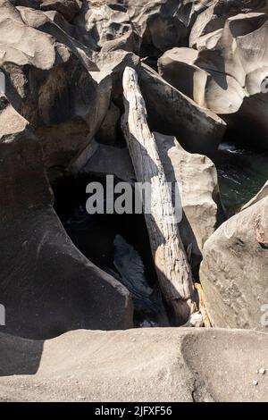 Beautiful view to rocky scenario with river cutting through stones Stock Photo