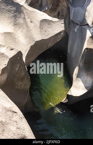 Beautiful view to rocky scenario with river cutting through stones Stock Photo