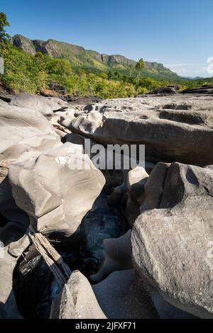 Beautiful view to rocky scenario with river cutting through stones Stock Photo