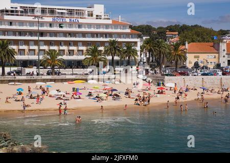 Beach with bathers at Cascais, Portugal, Europe. Stock Photo