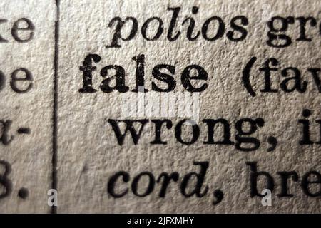 Definition of word false on dictionary page, close-up  close-up Stock Photo