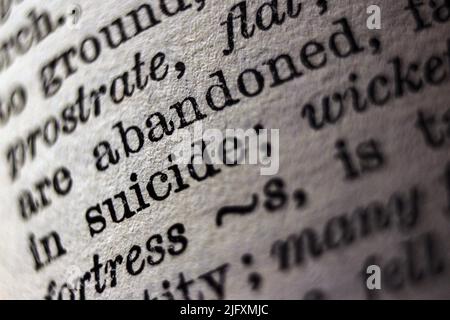 Definition of word suicide on dictionary page, close-up  close-up Stock Photo