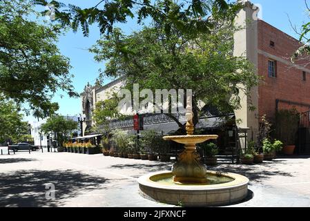 SANTA ANA, CALIFORNIA - 4 JUL 2022: Fountain and restaurant in the Artist District in Historic Downtown Santa Ana. Stock Photo