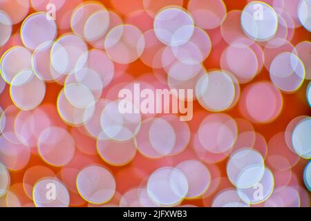 Background image with orange and white bokeh lights. Stock Photo