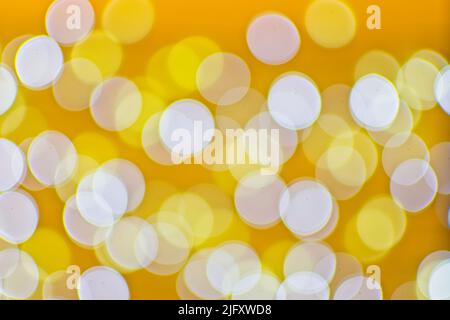Background image with yellow and white bokeh lights. Stock Photo