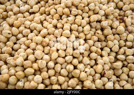 Hazelnut Background. Heap of peeled hazelnuts. Macro texture Stock Photo
