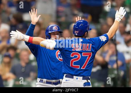 Milwaukee, WI, USA. 5th July, 2022. Chicago Cubs left fielder Ian Happ #8 high fives Chicago Cubs right fielder Seiya Suzuki #27 after he hits a two-run home run in the fifth inning during MLB game between the Chicago Cubs and the Milwaukee Brewers at American Family Field in Milwaukee, WI. Kirsten Schmitt/CSM/Alamy Live News Stock Photo