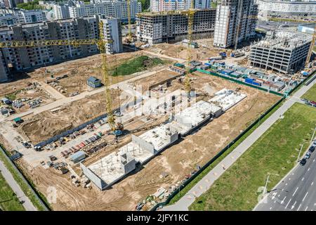 reinforced concrete foundation for multistory apartment building. new city residential area under construction. aerial view. Stock Photo