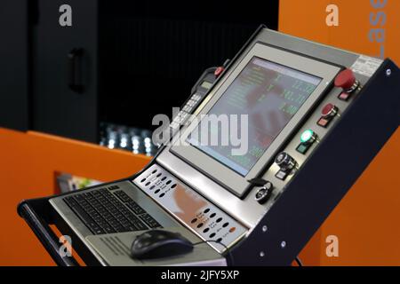 Operator console of CNC laser cutting machine. Selective focus. Stock Photo