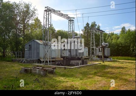high-voltage electrical substation against the blue sky Stock Photo