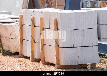 marble and stone slabs for laying floors in residential buildings in an outdoor warehouse Stock Photo