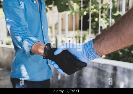 Gloved Handshake Wearing Gloves To Avoid Monkeypox And Diseases Gloved Hands Hold Stock Photo Alamy