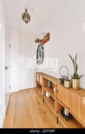 Corridor of contemporary apartment with closets and doorway leading to terrace Stock Photo