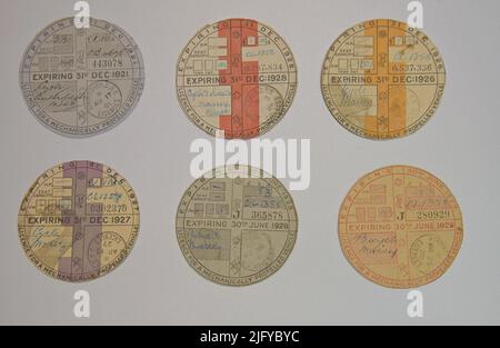 A Selection of vintage car tax discs for the road fund licence from the 1920's Stock Photo