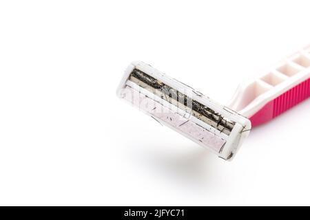 Close up pink used razor blade. Studio shot isolated on white background Stock Photo