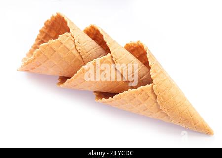 Set of three empty wafer ice cream cones isolated on white background. Top view Stock Photo