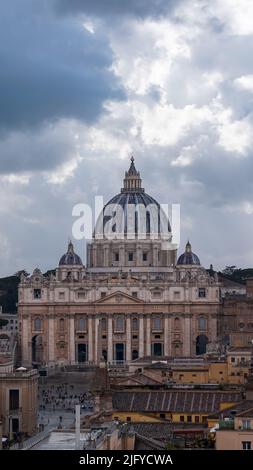 Vatican City, Vatican, March 2022. The beautiful Cathedral of Saint Peter pictured from Saint Angelo's Castle on a cloudy day. Stock Photo