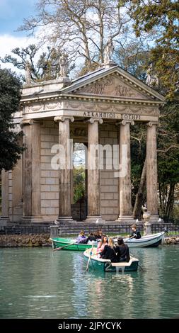 Rome, Italy, March 2022. The Temple of Aesculapius located in the gardens of the Villa Borghese. Iconic style temple with beautiful columns, paintings Stock Photo