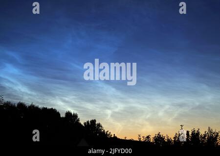 Noctilucent Clouds in July 2022, about Bavaria. Germany. Stock Photo