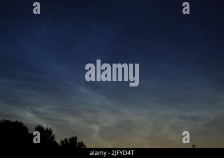 Noctilucent Clouds in July 2022, about Bavaria. Germany. Stock Photo