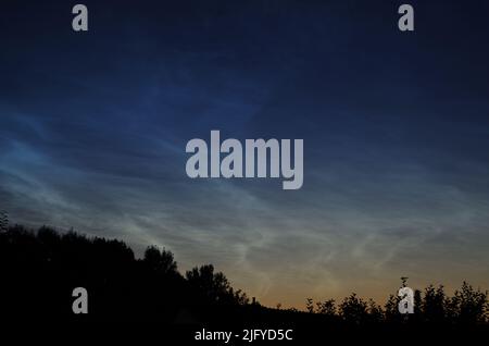 Noctilucent Clouds in July 2022, about Bavaria. Germany. Stock Photo