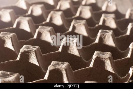 Abstract background. frame geometry. Egg packaging. Paper tray for domestic eggs. Beige and grey. Minimalism. Paper packaging egg carton Stock Photo