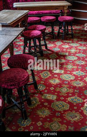 Pub stools at the Cockpit pub in St Andrew's Hill in the City of London. Stock Photo