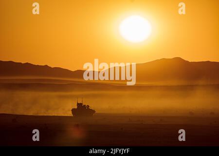 Fort Irwin, California, USA. 28th June, 2022. An 11th Armored Cavalry Regiment opposing force surrogate vehicle (OSV) maneuvers towards 56th Stryker Brigade Combat Team, 28th Infantry Division, positioned in the John Wayne Foothills on the morning of June 28, 2022 at the National Training Center, Fort Irwin, Calif. Credit: U.S. Army/ZUMA Press Wire Service/ZUMAPRESS.com/Alamy Live News Stock Photo