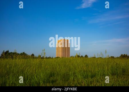 The North Dakota State Capitol, pictured here from the Capitol Grounds Native Prairie at Bismarck, is a 21-story Art Deco tower that is the tallest ha Stock Photo