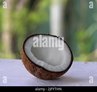 pure clean half coconut on the white table Stock Photo