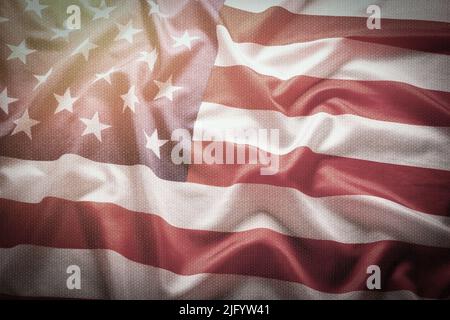 Background with fabric texture, flag United States America with bright sunlight Stock Photo